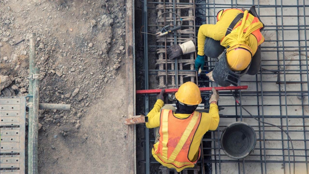 Two construction workers on construction site