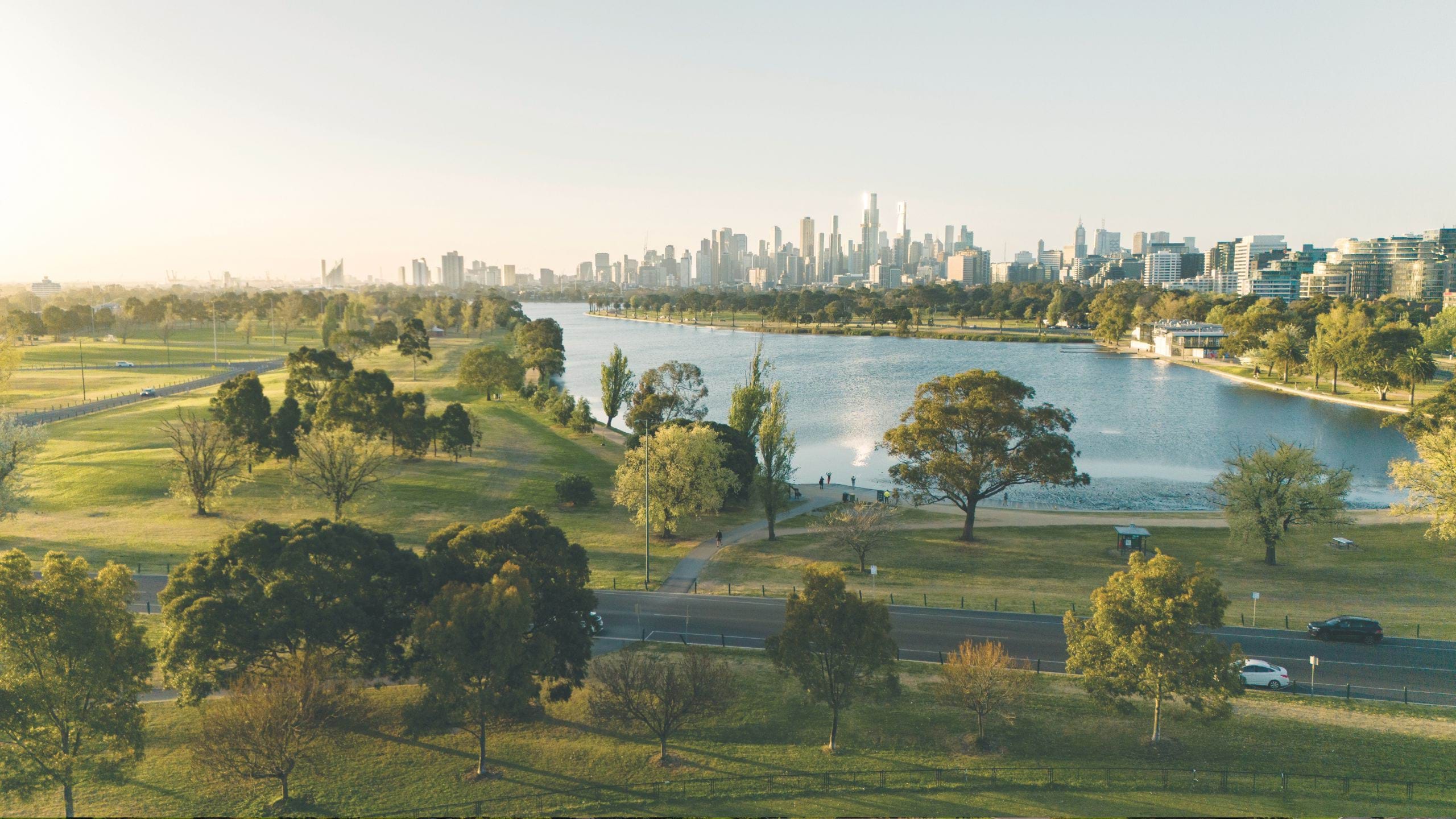 Aerial photo looking over Albert Park towards the Melbourne skyline